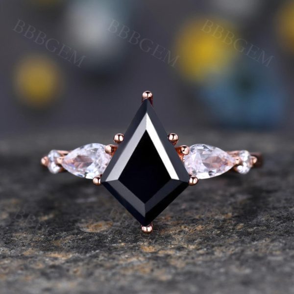 Lozenge-Shaped Step Cut Black Onyx Statement Ring with Pear Moissanite Accent Stone Supply