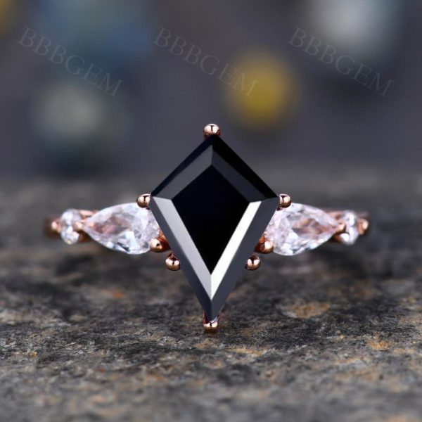 Lozenge-Shaped Step Cut Black Onyx Statement Ring with Pear Moissanite Accent Stone Supply